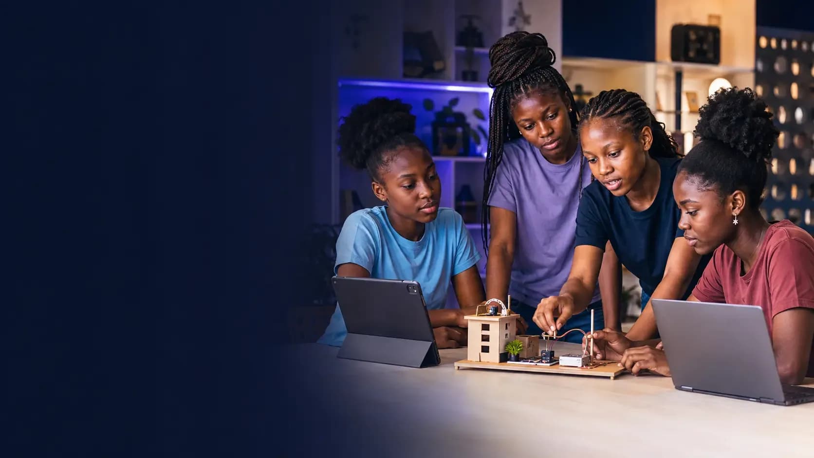 Girls collaborating on a technology project in an innovation space